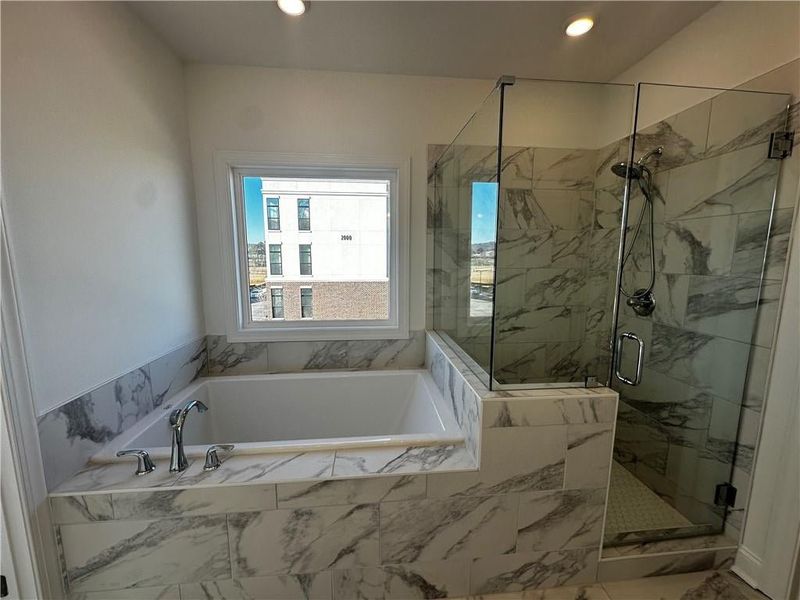 Decked Tub with Walk in Shower featuring Chrome fixtures