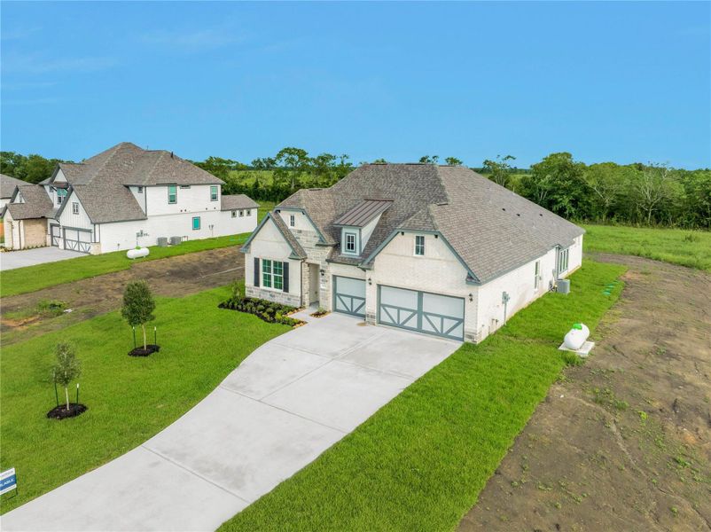 Front exterior of a new home in , Rosharon, TX, highlighting curb appeal (Image 22).