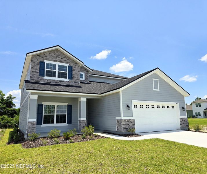 Front exterior of a new home in Hyland Trail, Green Cove Springs, FL, highlighting curb appeal (Image 1). Front exterior of a new home in Hyland Trail, Green Cove Springs, FL, highlighting curb appeal (Image 1).