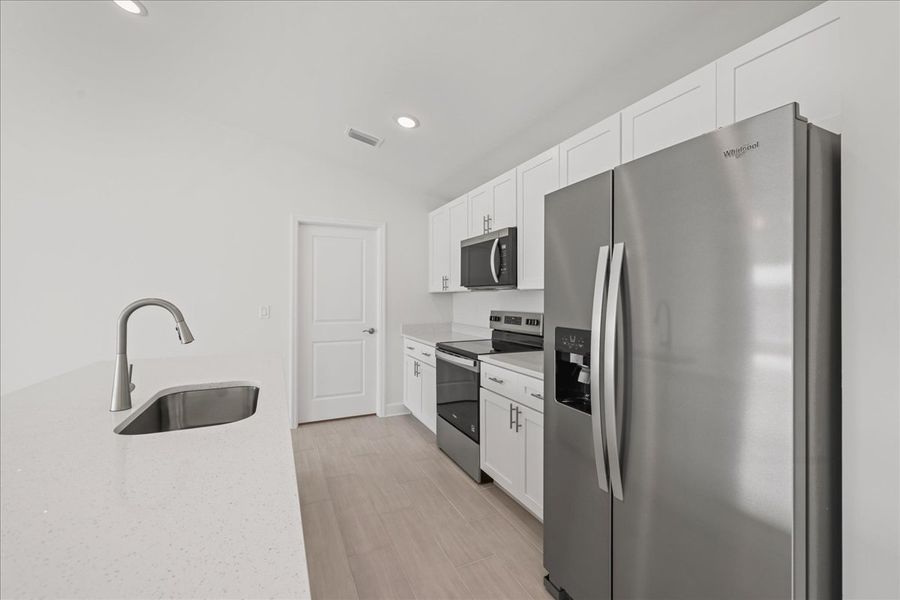 Representative furnished interior of a home built from the The Sunset Harbor by Sunlife Homes LLC in Cape Coral, Cape Coral (Image 10). Representative furnished interior of a home built from the The Sunset Harbor by Sunlife Homes LLC in Cape Coral, Cape Coral (Image 10).