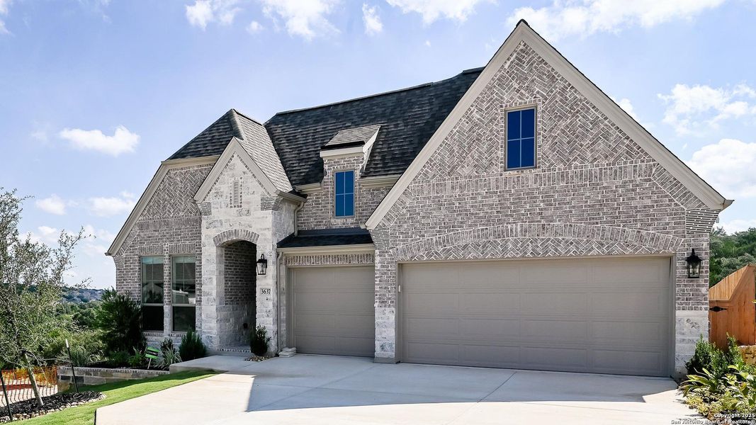 Front exterior of a new home in Johnson Ranch 55', Bulverde, TX, highlighting curb appeal (Image 18). Front exterior of a new home in Johnson Ranch 55', Bulverde, TX, highlighting curb appeal (Image 18).