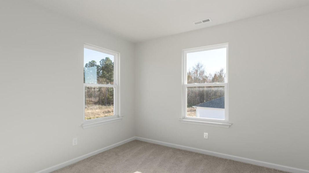 Representative unfurnished interior of a home built from the HARBOR OAK by D.R. Horton in Indigo Preserve, Leland (Image 38).