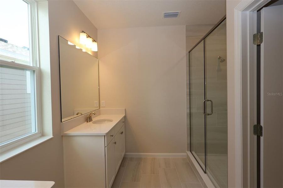 Furnished interior view inside a new home in Lake Star at Ovation, Winter Garden (Image 10).