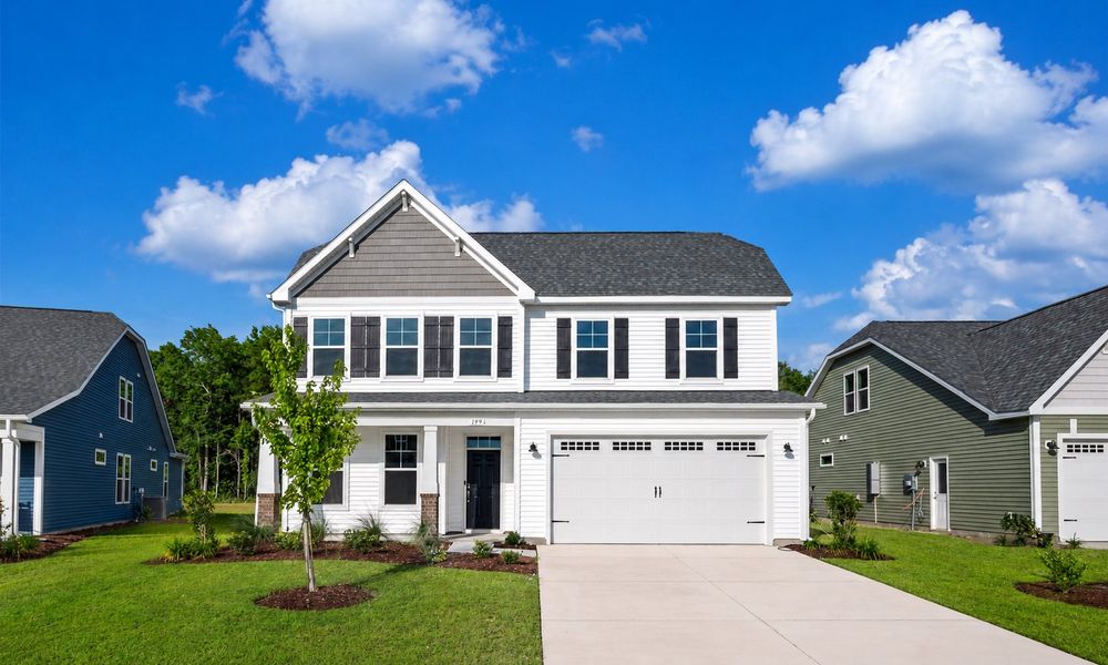 Front exterior of a new home in Traditions at Carolina Forest, Myrtle Beach, SC, highlighting curb appeal (Image 1). Front exterior of a new home in Traditions at Carolina Forest, Myrtle Beach, SC, highlighting curb appeal (Image 1).