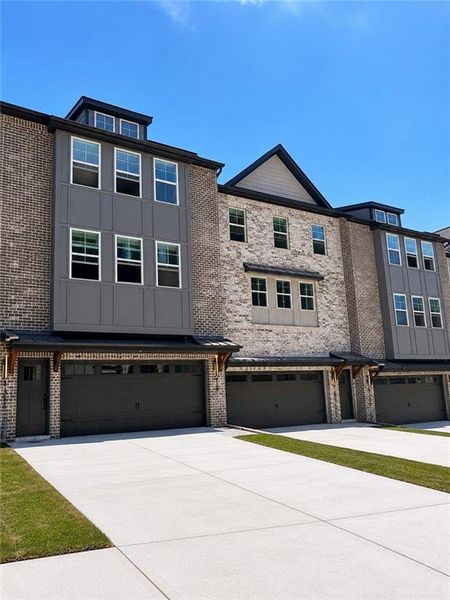 Front exterior of a new home in , Cumming, GA, highlighting curb appeal (Image 1). Front exterior of a new home in , Cumming, GA, highlighting curb appeal (Image 1).