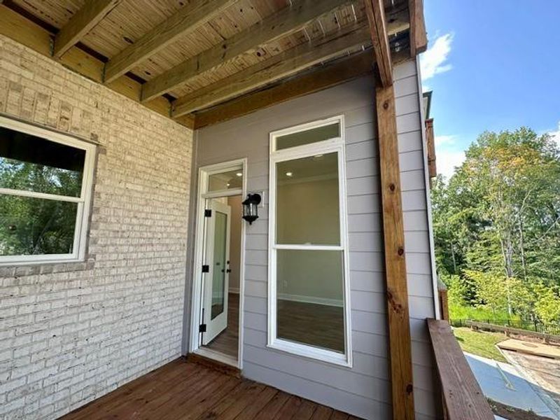 Exterior details and patio area of a home in Ward's Crossing Townhomes, Johns Creek (Image 24).