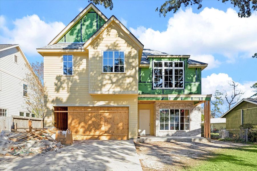 Layered materials and classic rooflines give this Harvard Homes build a strong architectural presence as construction progresses. Brick detailing, deep overhangs, and generous window placement hint at the light filled interiors and craftsmanship that will define the finished home. -- **Current construction as of 12/31/2025**