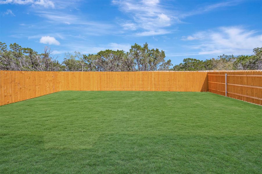 Exterior details and patio area of a home in Heritage, Dripping Springs (Image 3).