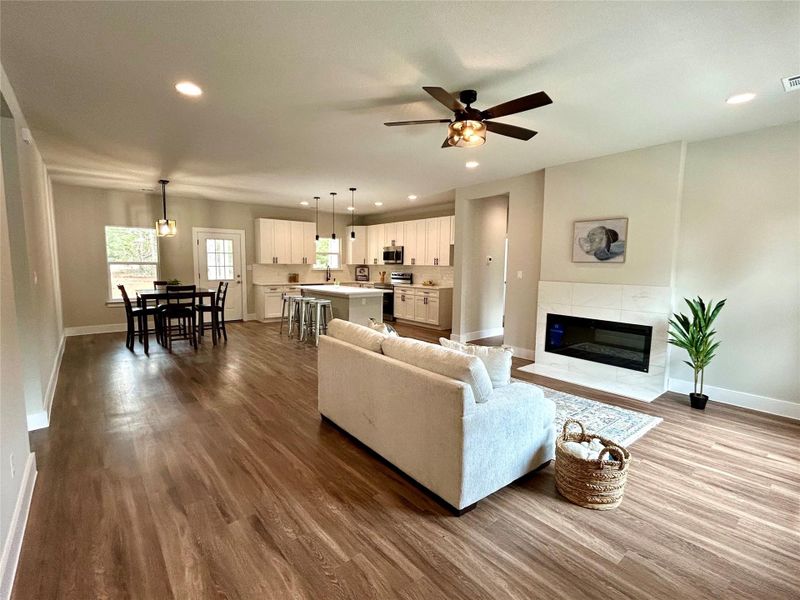 Open concept living, dining, and kitchen area. Open concept living, dining, and kitchen area.