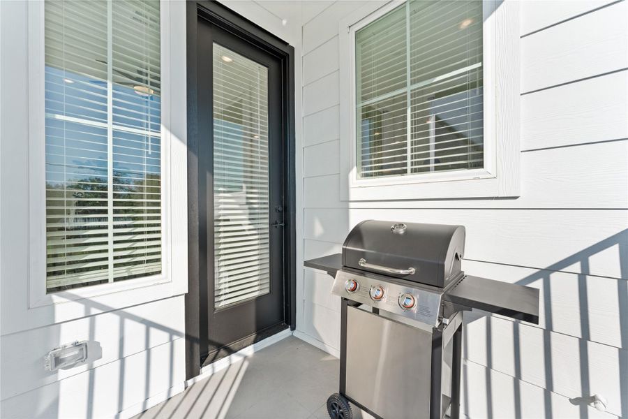 Exterior details and patio area of a home in Jensen Villas, Houston (Image 24).
