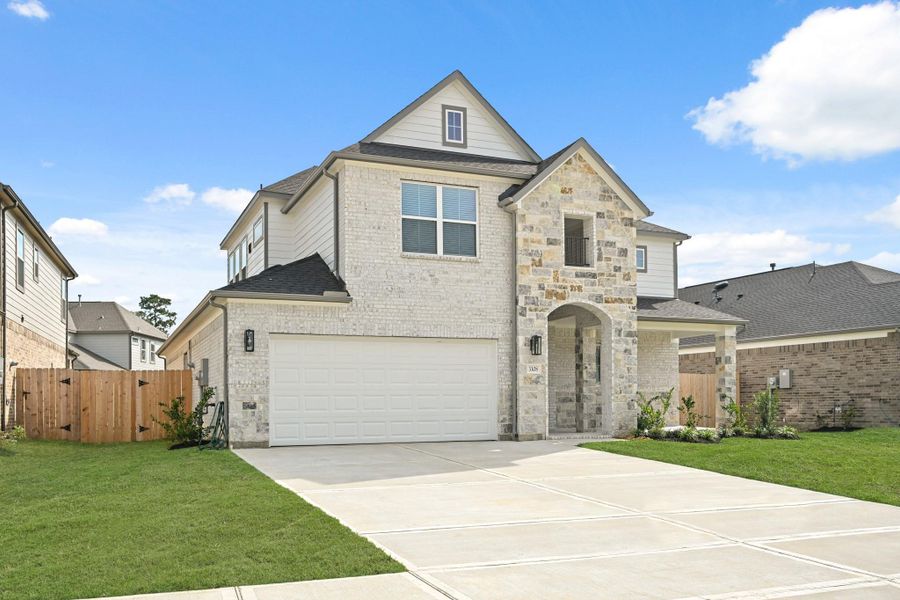 Front exterior of a new home in Barton Creek Ranch, Conroe, TX, highlighting curb appeal (Image 18). Front exterior of a new home in Barton Creek Ranch, Conroe, TX, highlighting curb appeal (Image 18).