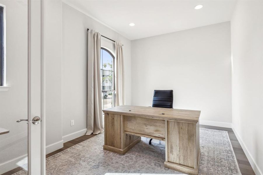 Unfurnished office featuring dark wood-type flooring