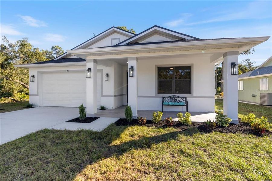 Front exterior of a new home in , Rotonda West, FL, highlighting curb appeal (Image 1).