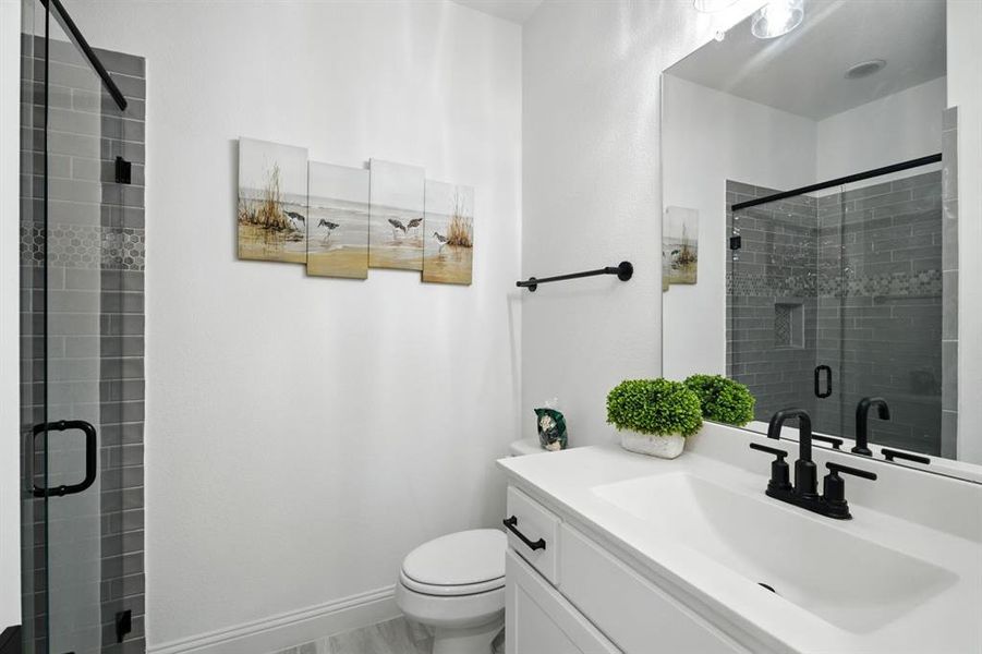 Downstairs full bathroom in the hallway.