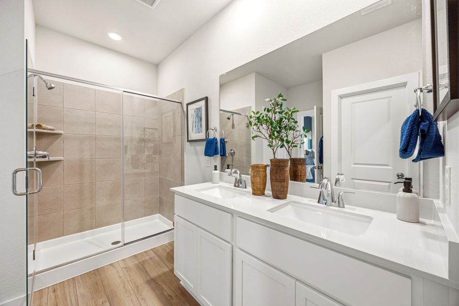A bathroom with a glass shower.
