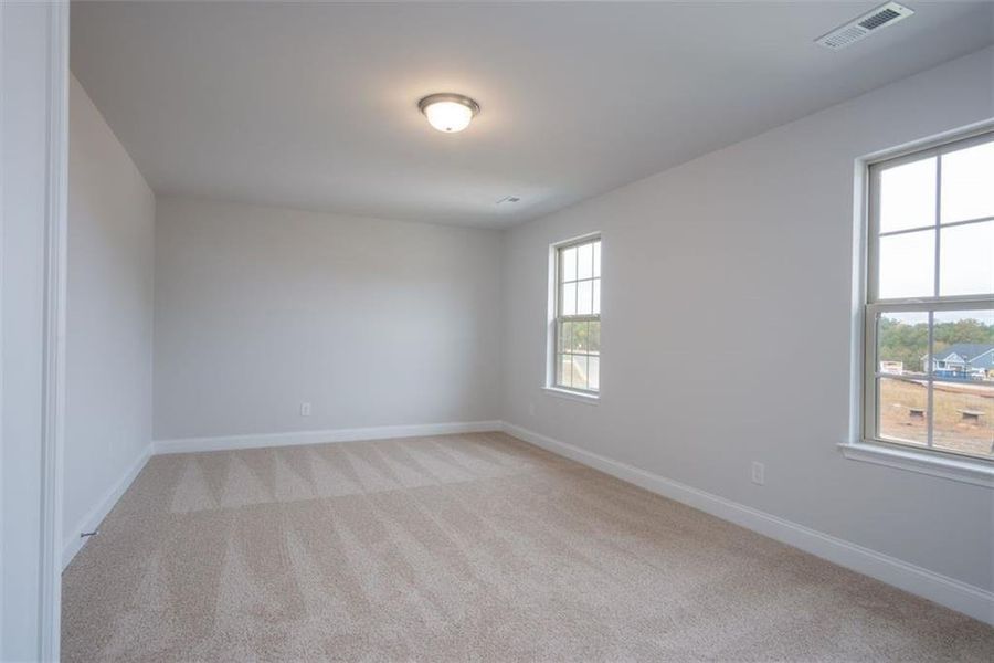 Spacious, unfurnished interior of a new home in Mirror Lake at South Harbour, Villa Rica (Image 22).