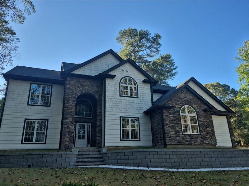 Front exterior of a new home in , Grayson, GA, highlighting curb appeal (Image 1).