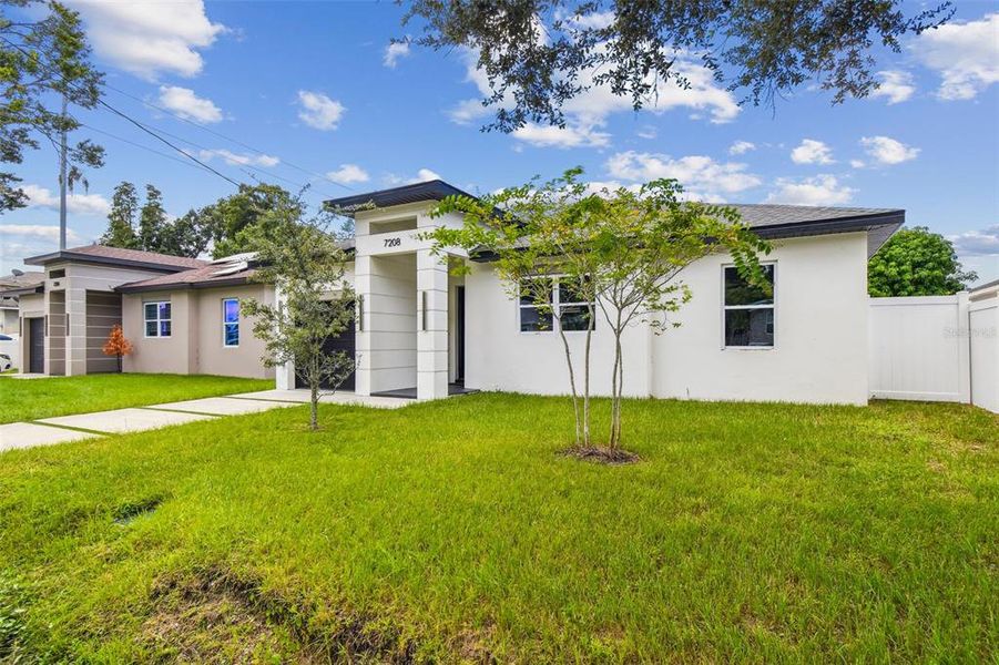 Front exterior of a new home in , Tampa, FL, highlighting curb appeal (Image 34).