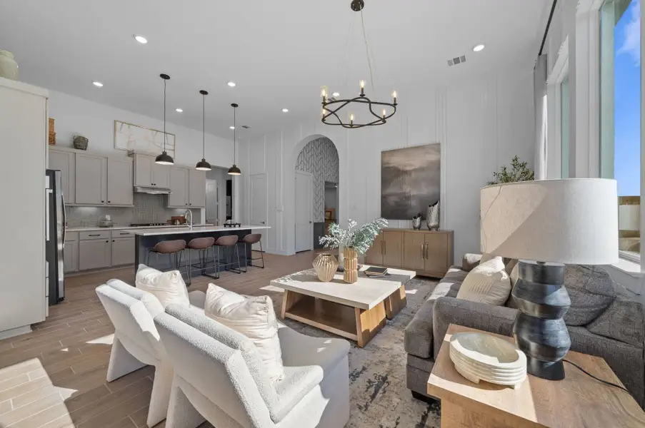 Representative furnished interior of a home built from the Bonneville by Chesmar Homes in University Heights, Round Rock (Image 5).
