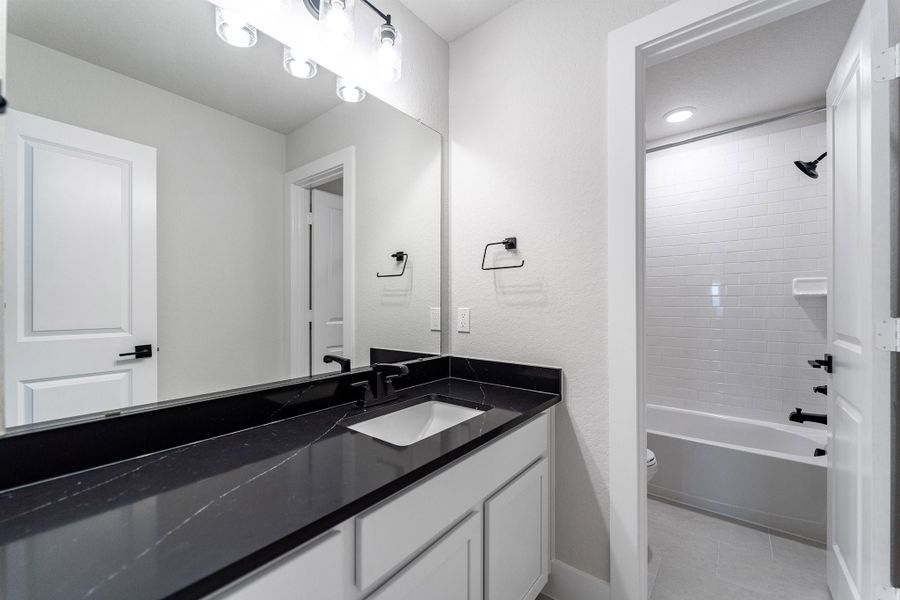 Furnished interior view inside a new home in The Woodlands at Medina Hills, Mico (Image 11).