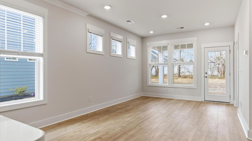 Hardwood flooring and high standards define this vibrant family room ideal for everyday living