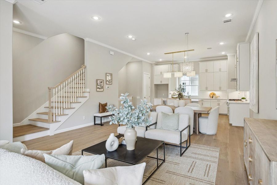 Living room filled with natural light and has an open floor plan.
