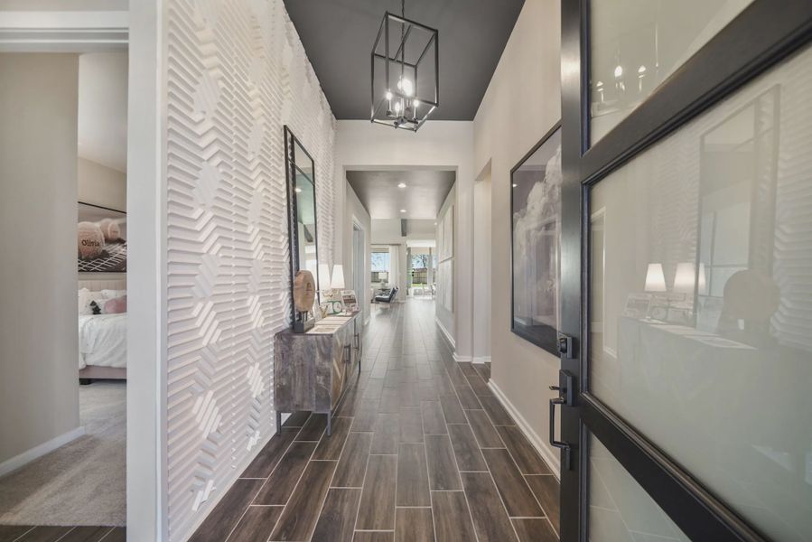 Representative furnished interior of a home built from the Montgomery by Chesmar Homes in Meridiana 50's and 60's, Manvel (Image 5).
