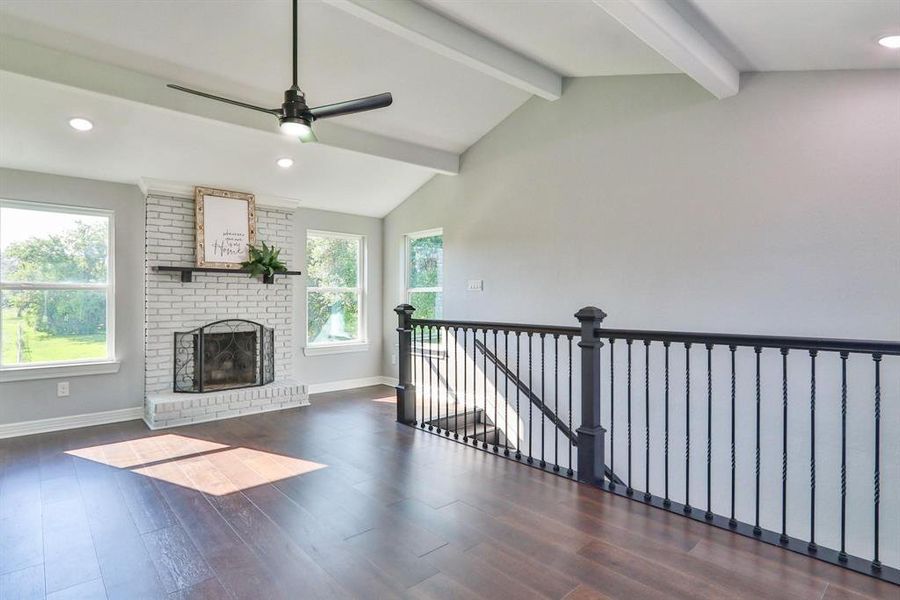 Impeccably Revitalised Classic Charmer! This home features a spacious game room / bonus room on the second level with cozy wood burning fireplace, engineered flooring and uninterrupted views.