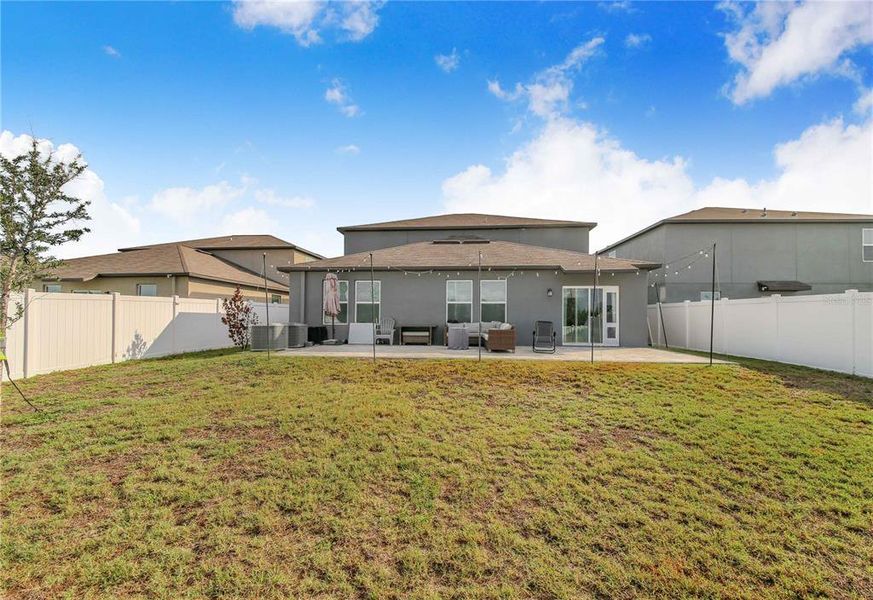 Exterior details and patio area of a home in Wind Meadows South, Bartow (Image 29).