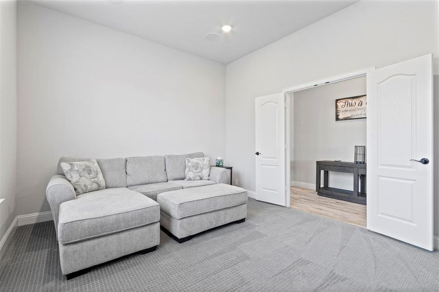 Living room with light hardwood / wood-style flooring