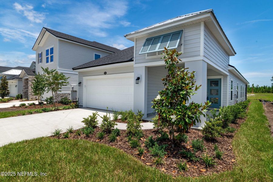 Front exterior of a new home in Beacon Lake, St. Augustine, FL, highlighting curb appeal (Image 29).