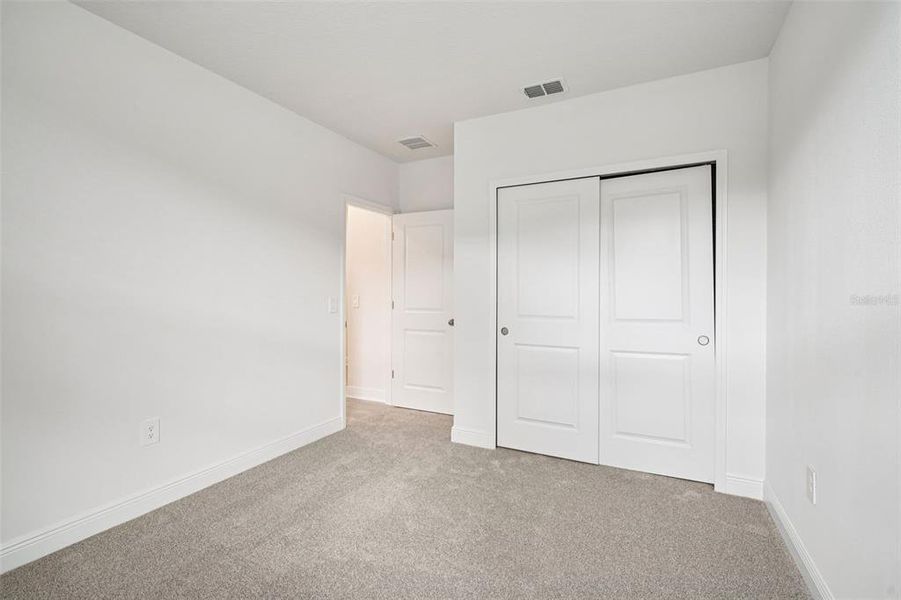 Spacious, unfurnished interior of a new home in The Reserve at Hammock Oaks - Signature Series, Lady Lake (Image 17).