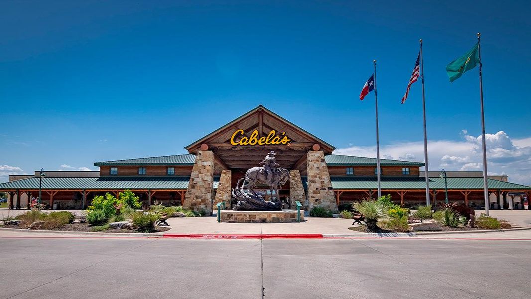 Front exterior of a new home in Paramount, Kyle, TX, highlighting curb appeal (Image 1).