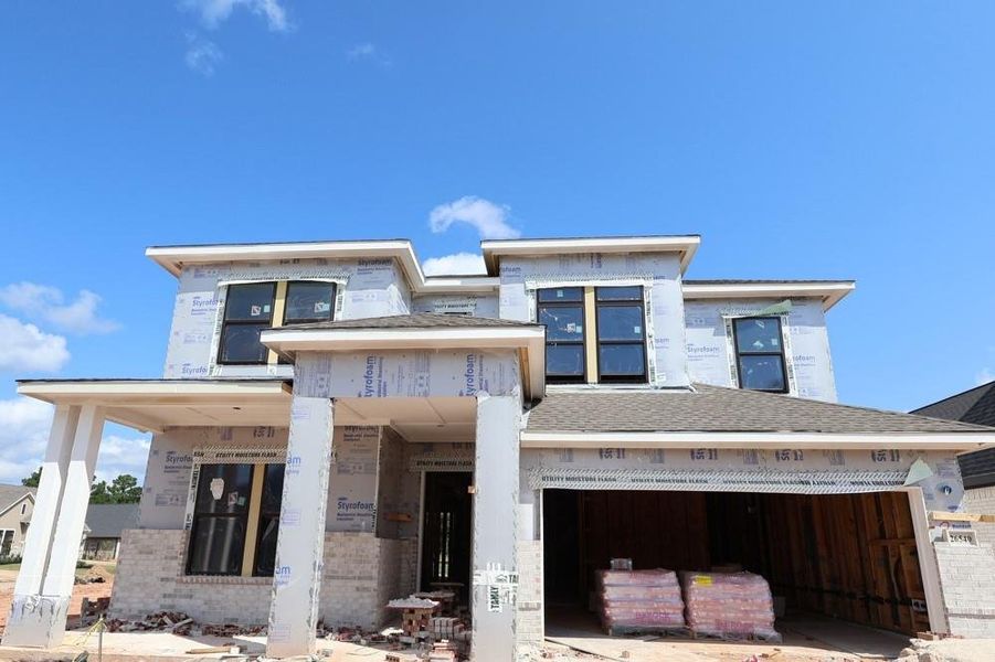 Front exterior of a new home in Kresston, Magnolia, TX, highlighting curb appeal (Image 2).