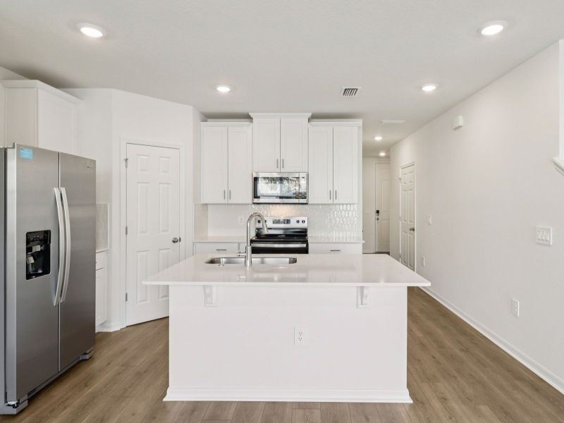 Furnished interior view inside a new home in Cagan Crossings West, Clermont (Image 3).