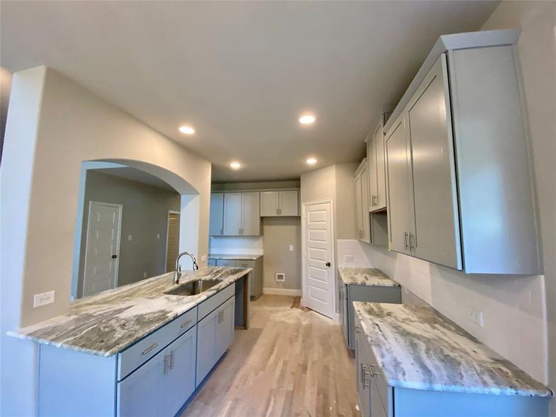 Great kitchen for entertaining! Gas GE stainless appliances not installed yet. (Rich hardwood floors not stained yet)