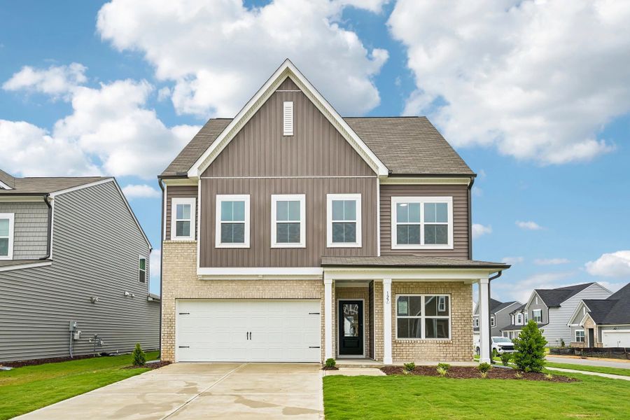 Front exterior of a new home in Crescent Mills, Wilson's Mills, NC, highlighting curb appeal (Image 2). Front exterior of a new home in Crescent Mills, Wilson's Mills, NC, highlighting curb appeal (Image 2).