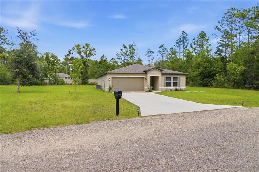 Front exterior of a new home in Citrus Springs, Citrus Springs, FL, highlighting curb appeal (Image 23). Front exterior of a new home in Citrus Springs, Citrus Springs, FL, highlighting curb appeal (Image 23).