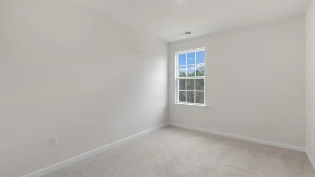 Spacious, unfurnished interior of a new home in The Townes at Galvins Ridge, Sanford (Image 21).