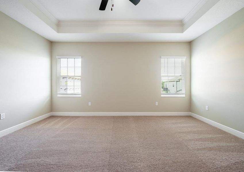 The master bedroom has two large windows.