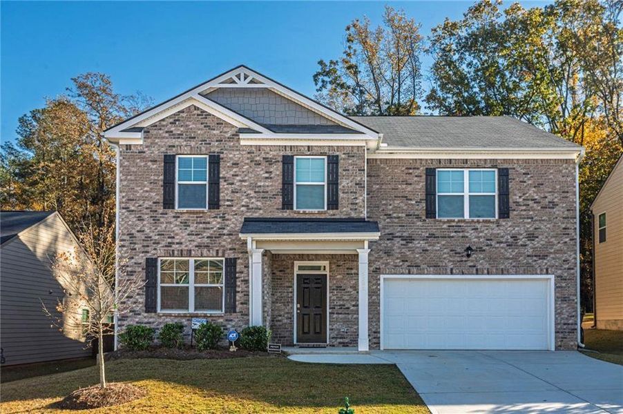 Front exterior of a new home in , Stonecrest, GA, highlighting curb appeal (Image 2).