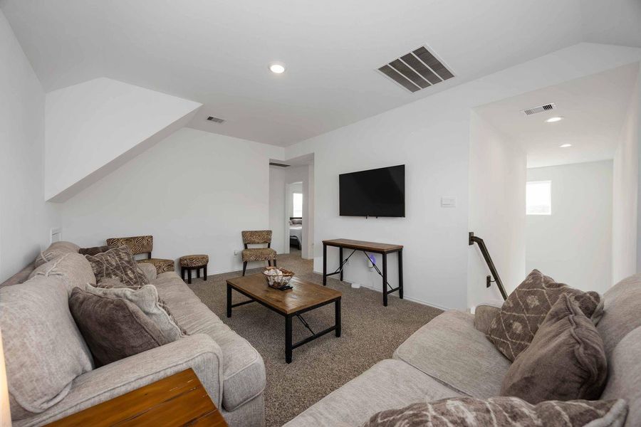 Upstairs game room offers flexible living space Upstairs game room offers flexible living space