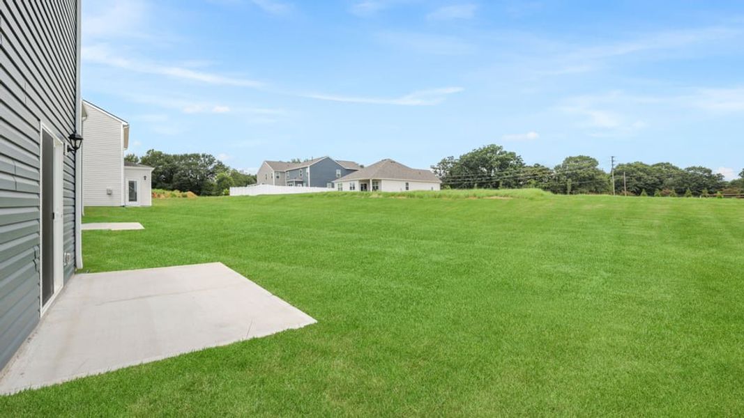 Exterior details and patio area of a home in Durbin Meadows Traditions, Fountain Inn (Image 20).