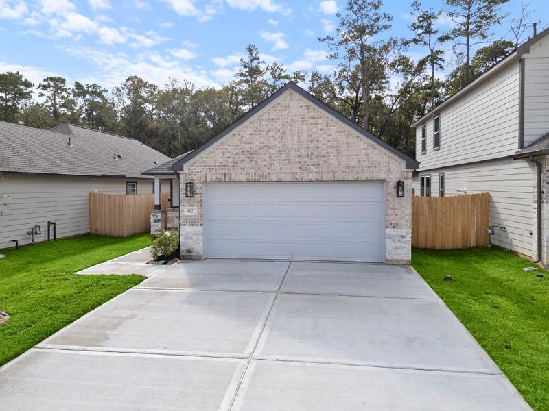 Front exterior of a new home in Cypresswood Landing, Humble, TX, highlighting curb appeal (Image 12).