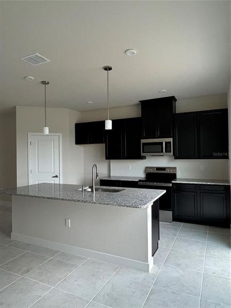 Furnished interior view inside a new home in Kendall Pointe, Melbourne (Image 3).