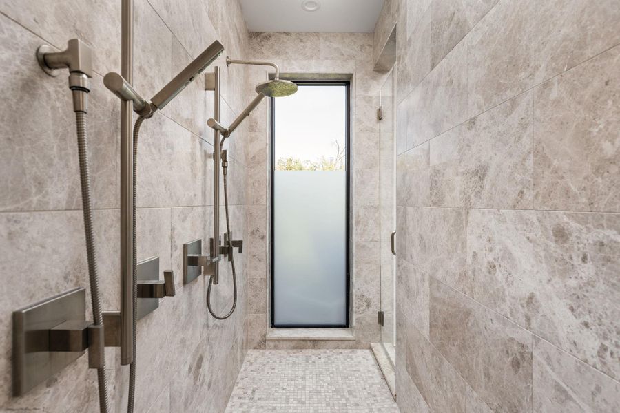 Full bath featuring a stall shower Full bath featuring a stall shower