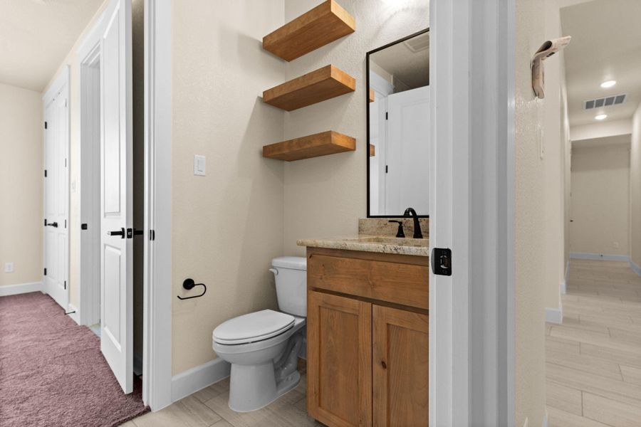 Bathroom featuring vanity, light wood-type flooring, and recessed lighting Bathroom featuring vanity, light wood-type flooring, and recessed lighting