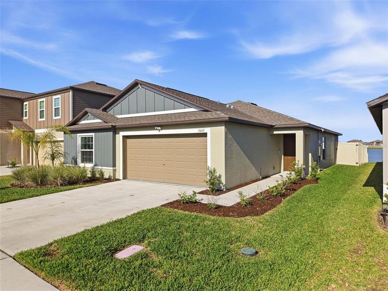 Front exterior of a new home in North Park Isle, Plant City, FL, highlighting curb appeal (Image 23).