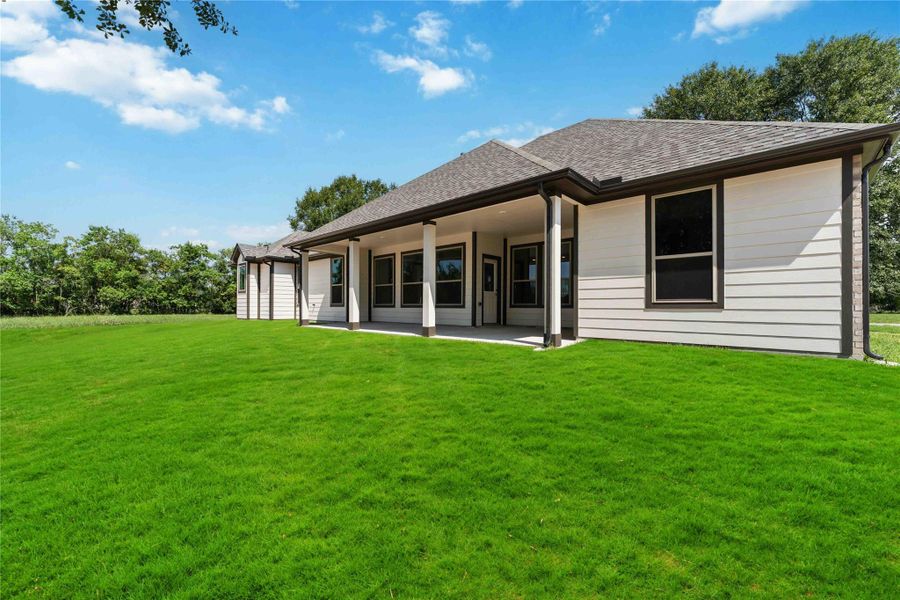 Front exterior of a new home in Barton Place, Cleveland, TX, highlighting curb appeal (Image 15). Front exterior of a new home in Barton Place, Cleveland, TX, highlighting curb appeal (Image 15).