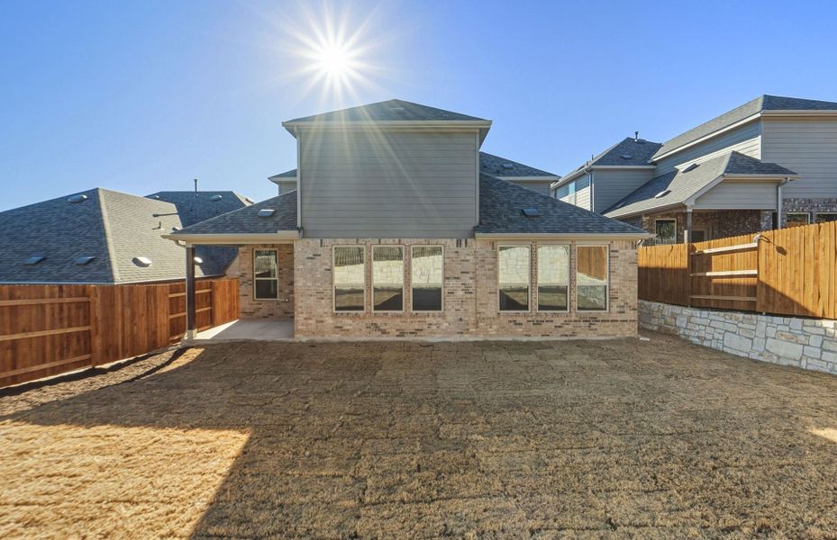 Exterior details and patio area of a home in West Cypress Hills, Spicewood (Image 28).